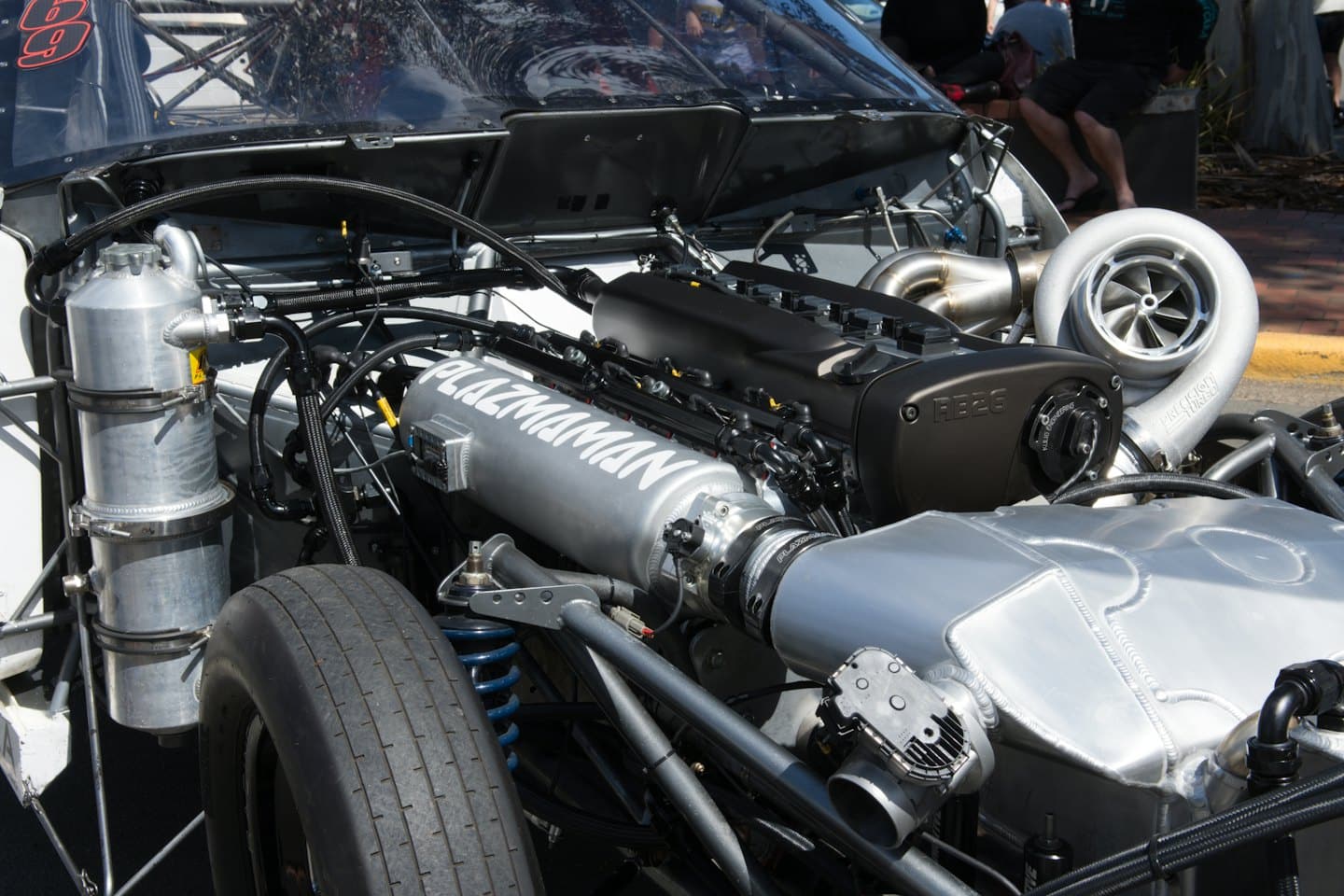 Intricate mechanical components inside a high performance car engine bay.